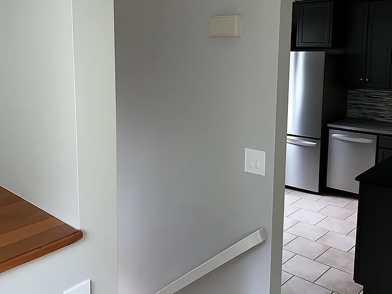 View from main stairway toward kitchen