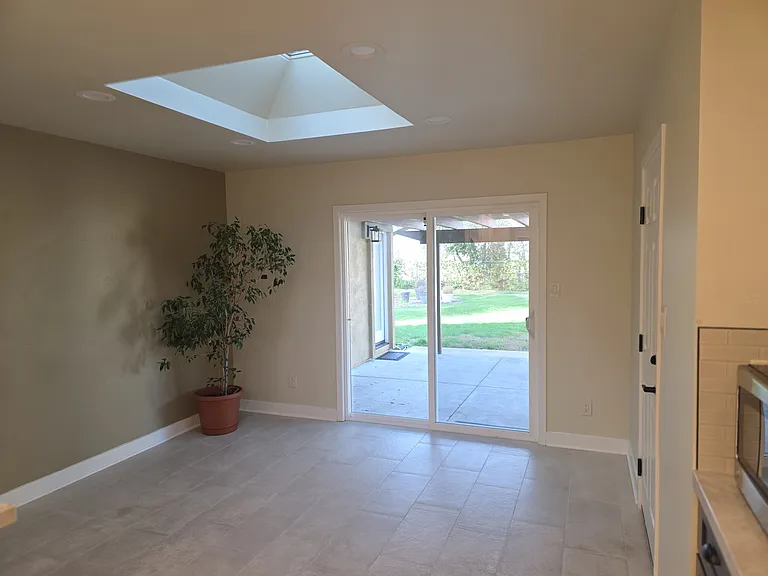 Dining area with skylight off kitchen