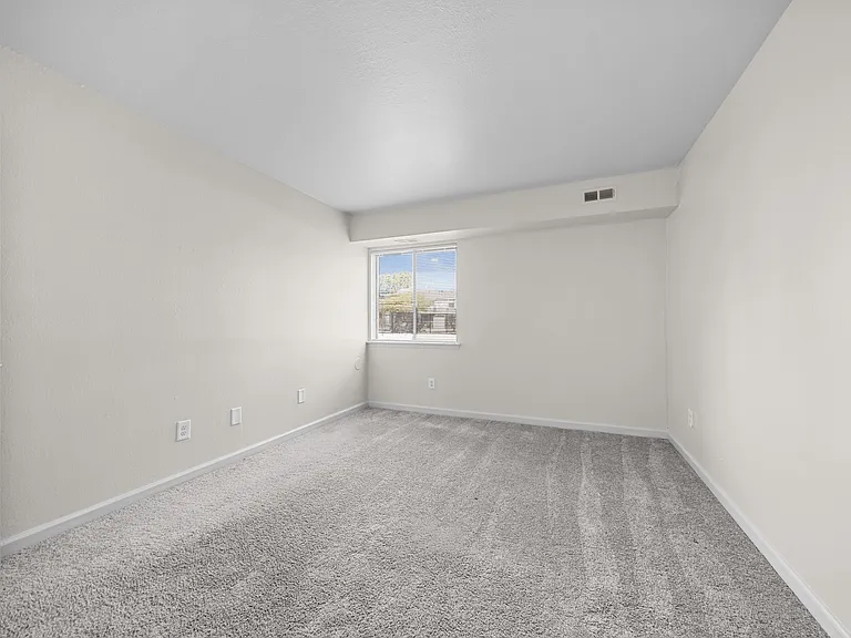 Large bedroom at Three Oaks Apartments in Troy, MI