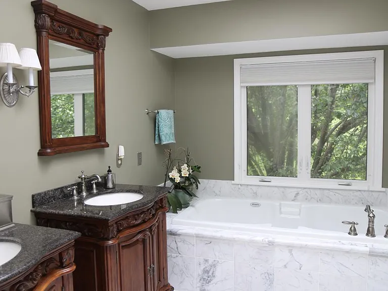 Master bathroom with separate sinks and vanities
