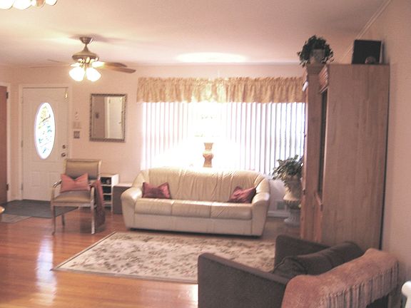 Living Room w/Fireplace & Refinished Hardwood Flooring