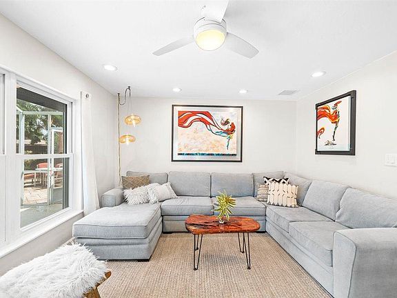 Relax here with views of the pool and back yard.