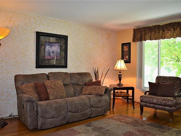 Enjoy the abundant light in this Living Room with hardwood floors!