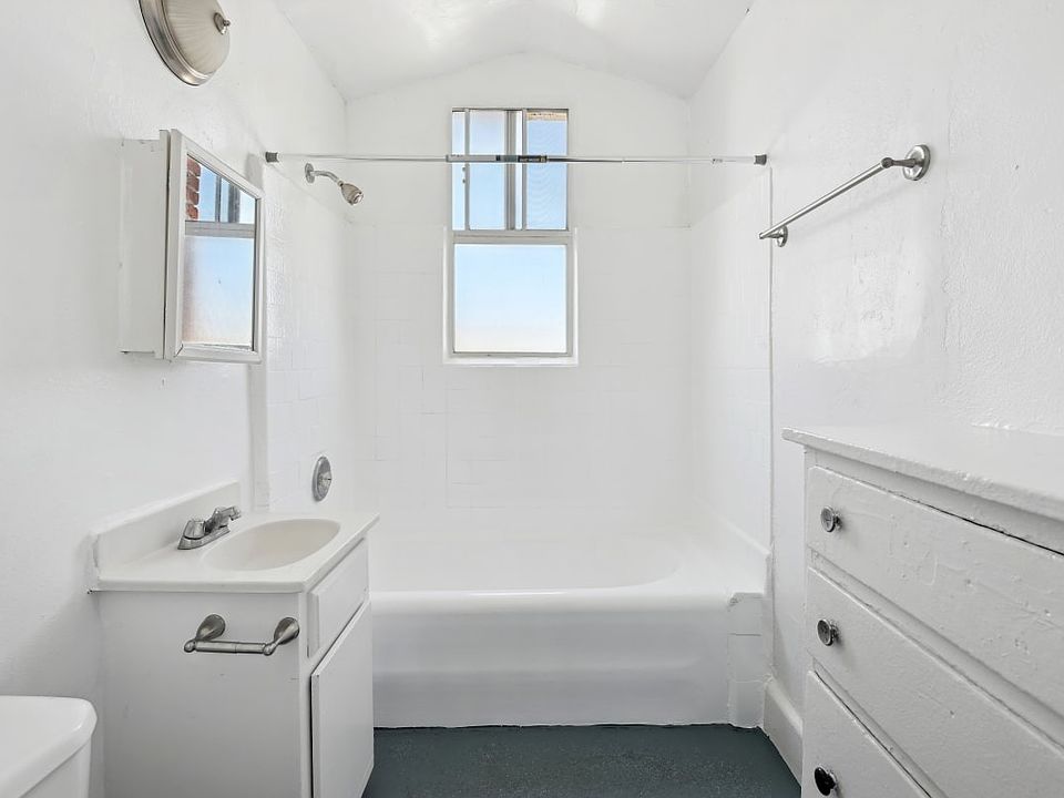 Union a bathroom with white walls and a window