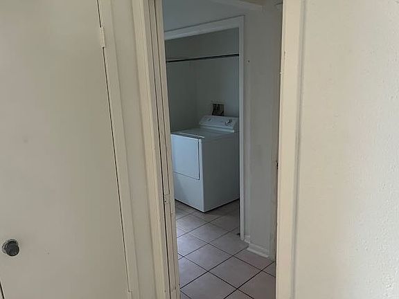 Laundry room with washer