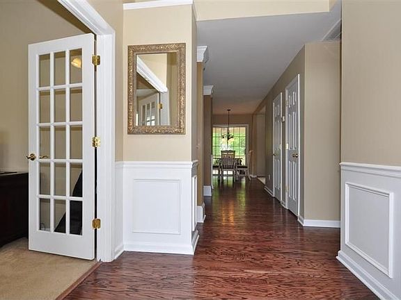 2-story foyer with hardwoods and generous millwork. Plus a designer chandelier