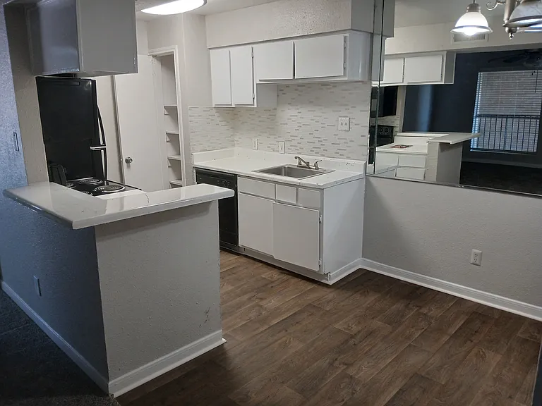 Kitchen with dining room area.