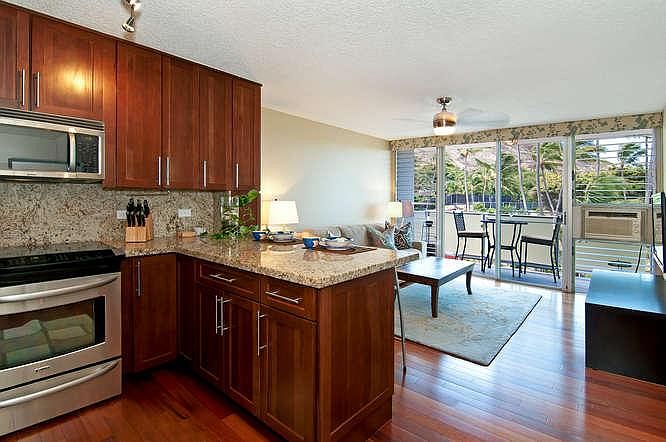 Kitchen with granite counter tops, stainless steel appliance