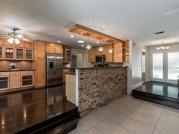 Updated central kitchen, open concept plan