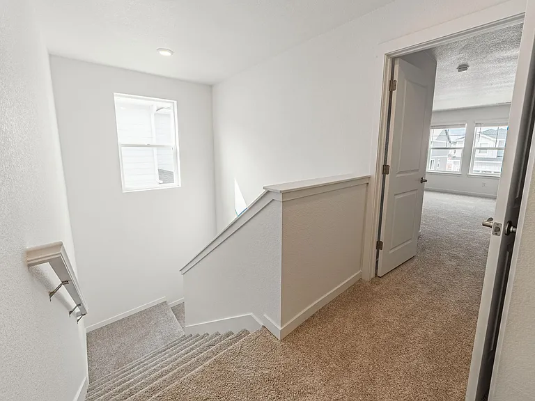 Top of stairs looking into master bedroom