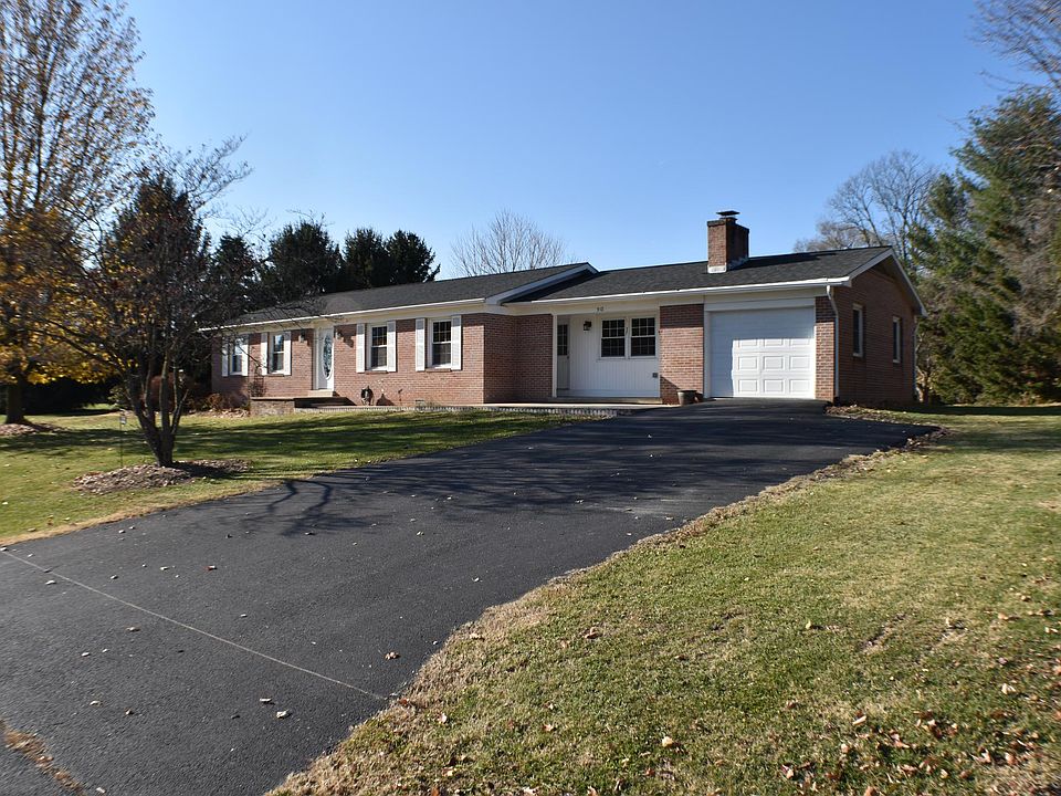 Driveway with parking for 4 vehicles.