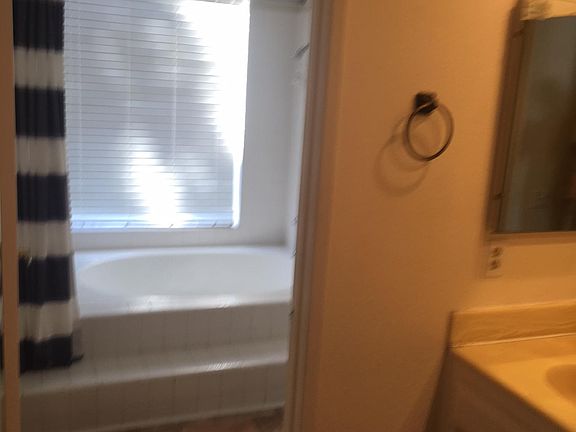 Dressing area view toward step up tub shower combo