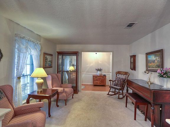 This Delightful, Warm Formal Living Room Invites Family Enjoyment!