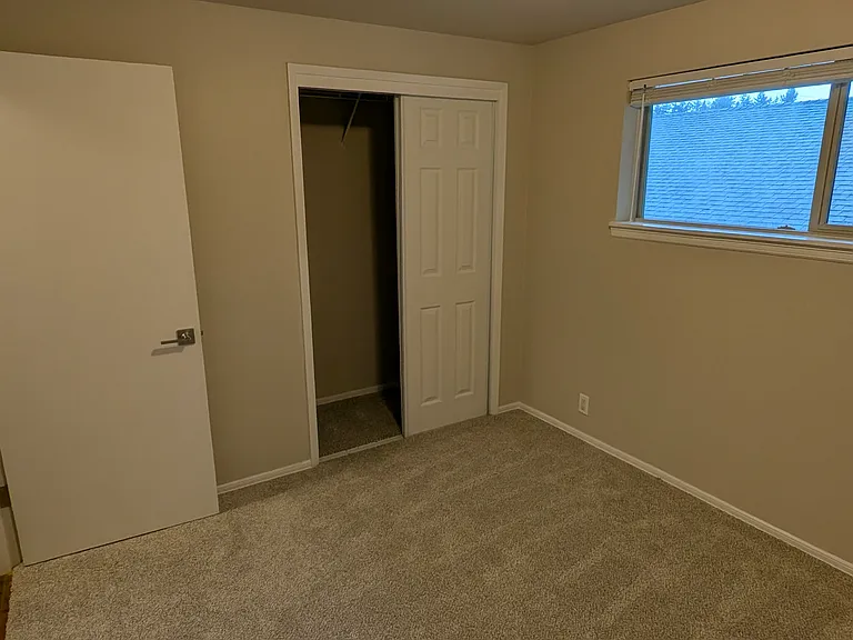 First bedroom, luxurious carpet, new closet doors