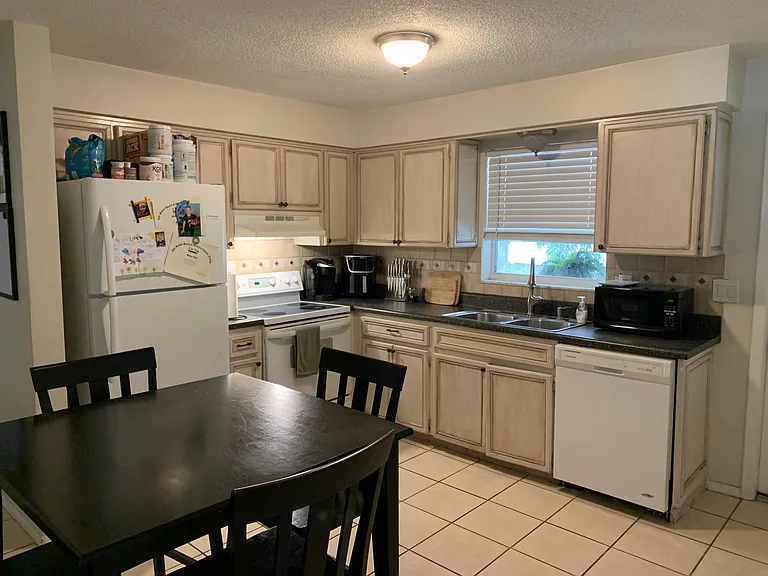 Kitchen with stove and refrigerator