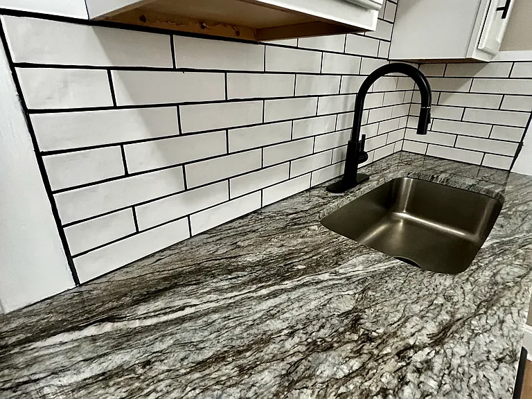 Granite countertops and subway tile back splash