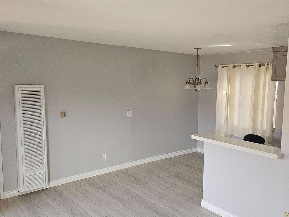 view from living room into dining area and kitchen