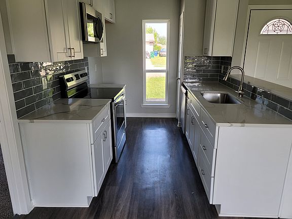 Includes electric stove, Microwave and dishwasher