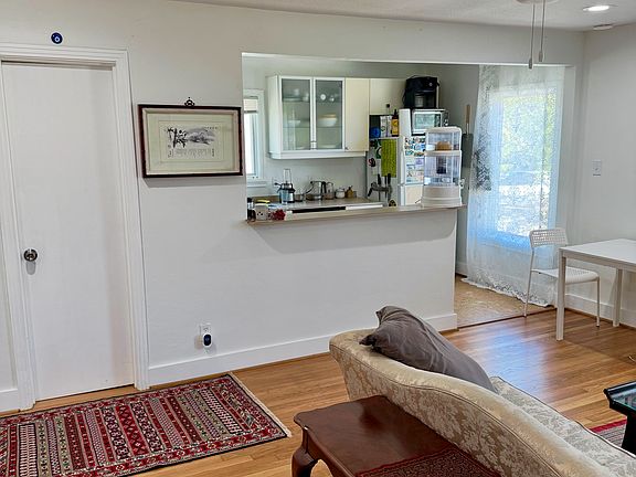 The kitchen is attached to the living space. Behind the door is the guest bathroom.