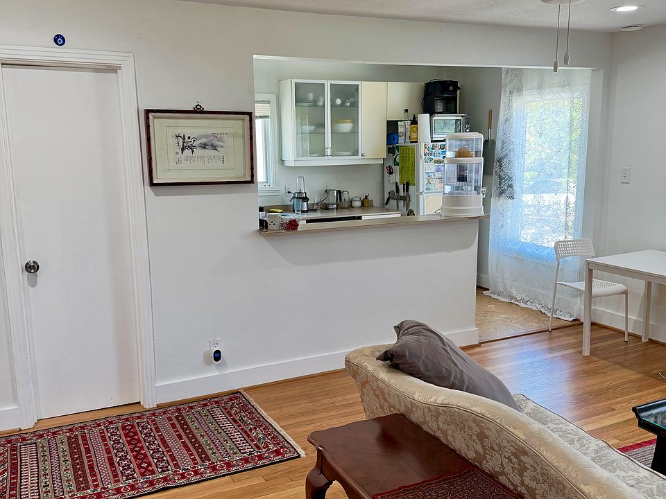The kitchen is attached to the living space. Behind the door is the guest bathroom.