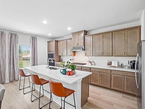 Kitchen in the Wilson floorplan at a Meritage Homes community in Zebulon, NC.