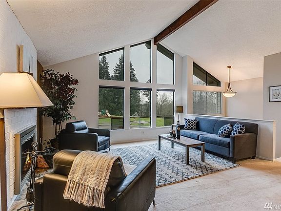 Relax in the spacious master suite and gorgeous ensuite bathroom. The family room is located on the lower level and also features an exposed beam and brick fireplace creating a cozy gathering space. The downstairs guest bedroom  has a large walk-in closet and slider door to access the lower patio.  This home is located across from the private neighborhood park and a short distance to Fairwood's King County Library. Enjoy convenient access to I-405, SeaTac airport, hospital, major retail, dining and business hubs