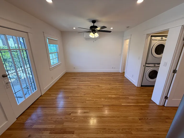 EXPANSIVE LIVING ROOM WITH BRAND NEW OAK HARDWOOD FLOORS