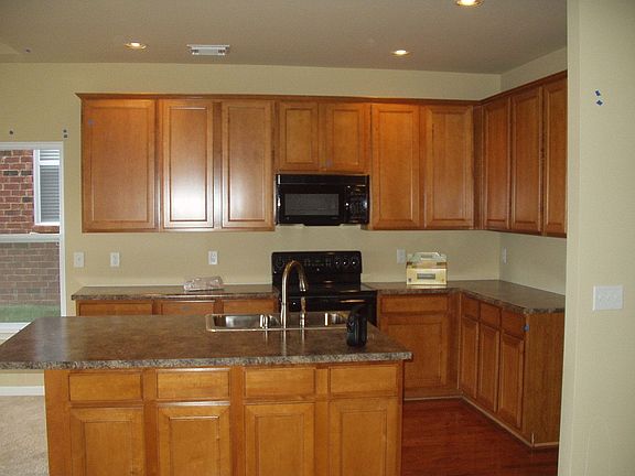 Kitchen with upgraded cabinetry, drawer pulls have been added. 