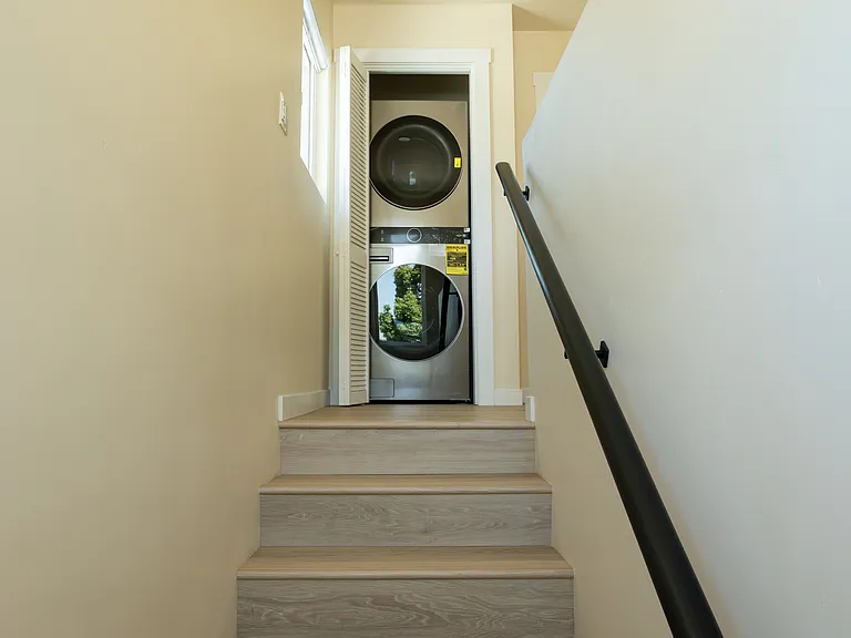 Laundry at top of stairs.