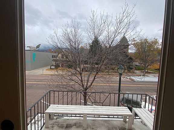 View to front patio. Patio includes two benches.