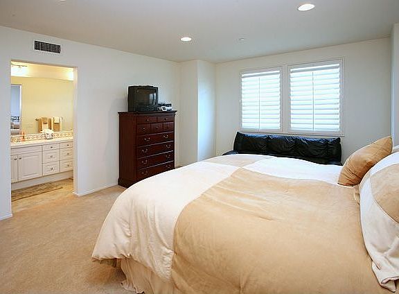 Master bedroom leading to bath