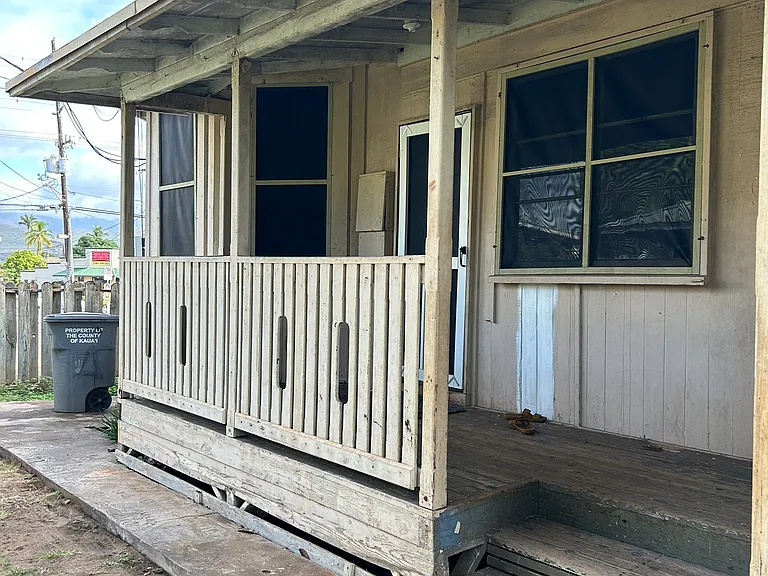 Duplex Front View. Work in progress but solid. New screens, flooring, bathroom and walking distance to the grocery store.