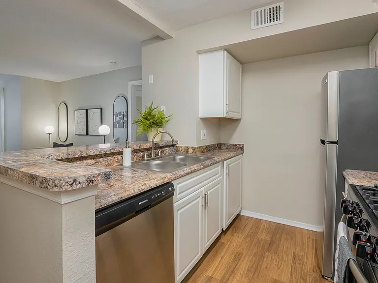 Delight in a breakfast bar that harmonizes with the living area, creating an airy and inviting atmosphere.