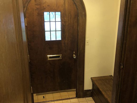 Entry foyer with built in cabinet and closet