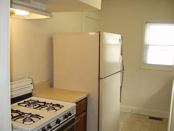 Kitchen view of the stove and refrigerator