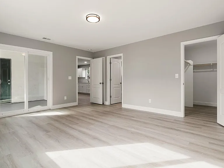 Master Bedroom photo with view of bathroom and walk-in Closet