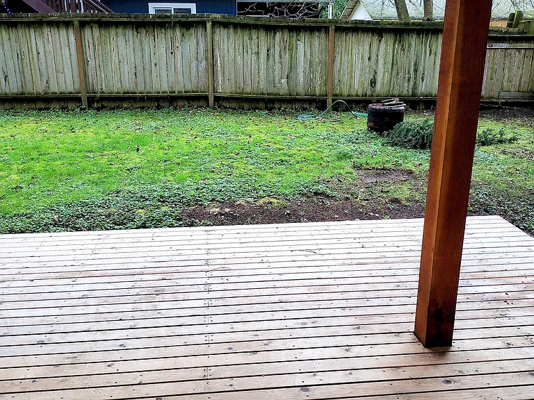Fenced in back yard with a nice deck. Adirondak chairs and a BBQ are provided for outdoor enjoyment.