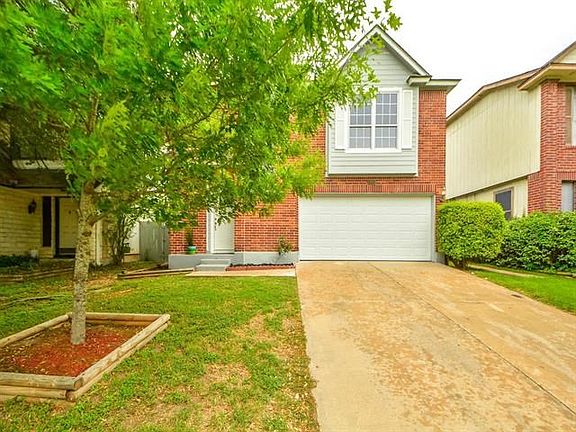 Lovely curb appeal and shade tree in the front yard.
