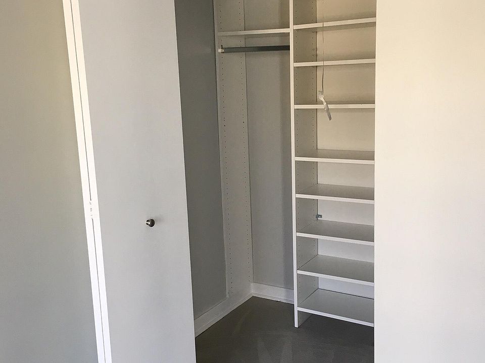 Walk-in closet with built ins in bedroom