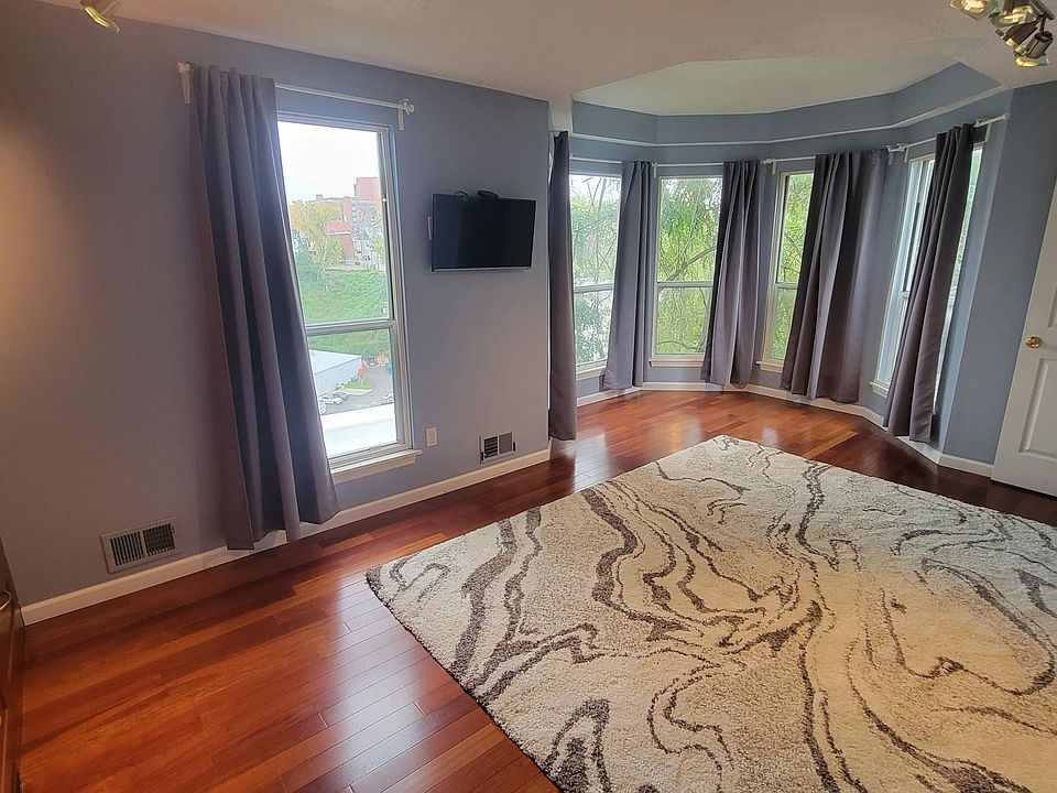 Master bedroom with bay windows, Apple TV