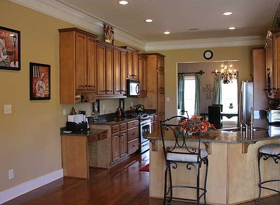 This kitchen is a cooks dream. Hardwood floors, granite counter-tops and space space space. Open, ai