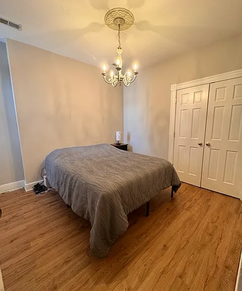 Bedroom on the left side, middle bedroom upstairs. This room has the emergency fire exit stairs going down with a exit door.
