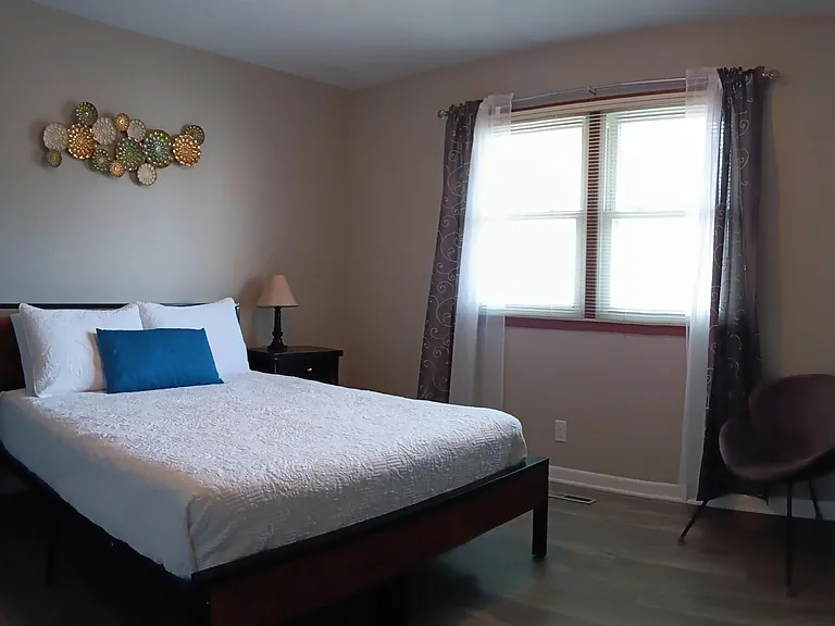 Master bedroom with large closet and shared bathroom adjoining.