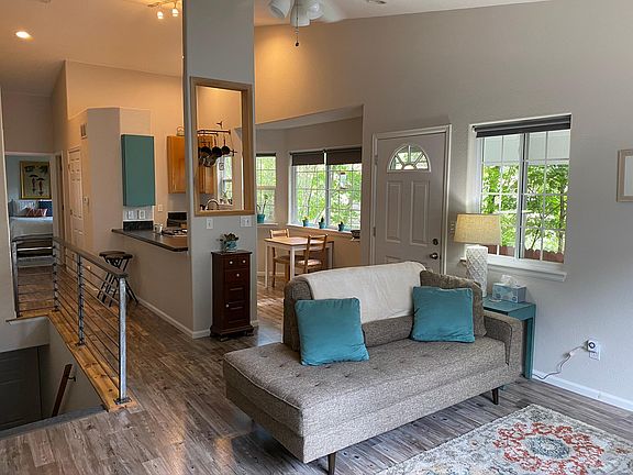 Here is the main room set up as a sitting room with a small table in the kitchen nook.