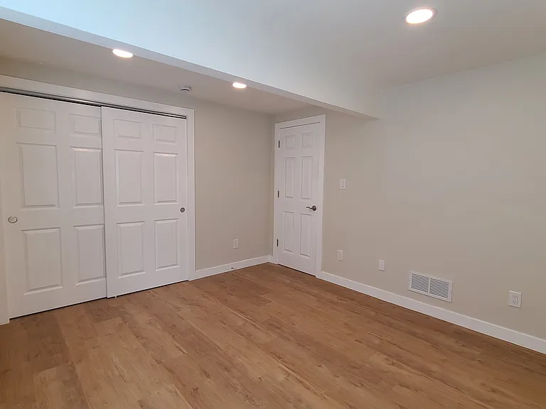 Closet and entry door to bedroom 1
