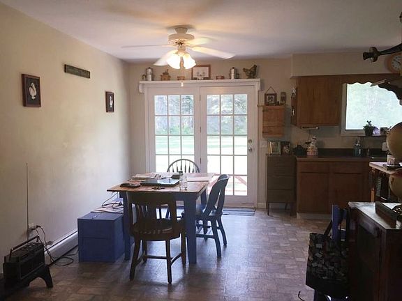 The kitchen has hardwood floors and has a patio door leading to the back yard.