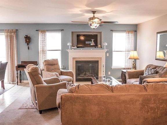 Bright, spacious living room with gas fireplace