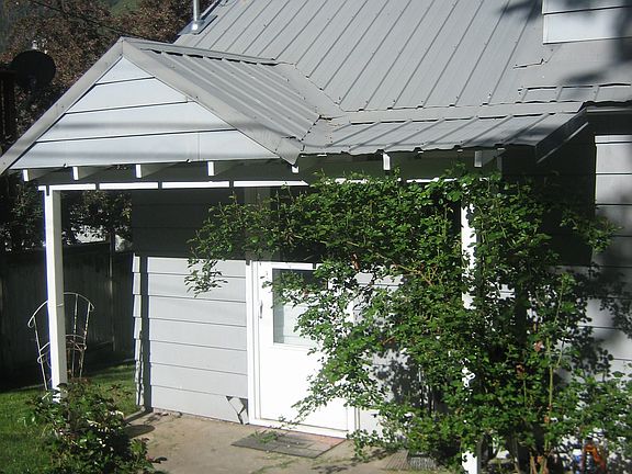 Small poured concrete pad off of the kitchen door- great for early morning coffee