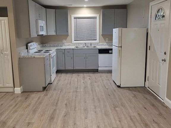 Newly renovated kitchen with new stove and microwave. Dishwasher and refrigerator included.