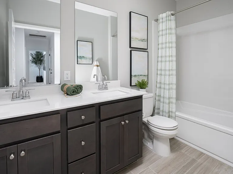 Second full bath - offering a bathtub for relaxation and dual sinks for convenience
